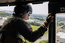 U.S. Marine Corps Gunnery Sgt. Taylor Gunderson, a helicopter crew chief with Marine Light Attack Helicopter Squadron-773, Marine Aircraft Group-49, 4th Marine Aircraft Wing, Marine Aircraft Group-49, 4th Marine Aircraft Wing, participates in an Orientation and Indoctrination Flight as part of Marine Week Nashville in Nashville, Tennessee, June 3, 2025. The O&I flights allowed an opportunity for community leaders around Nashville to see and experience Marine Corps aviation, and interact with the Marines maintaining and flying these aircraft. Throughout 2025, Marines across the globe will celebrate the 250th birthday of the Corps, commemorating service, sacrifice, and priding themselves on living 'Semper Fidelis' or 'Always Faithful' to their nation and to each other. (U.S. Marine Corps photo by Lance Cpl. Judith Ann Lazaro)