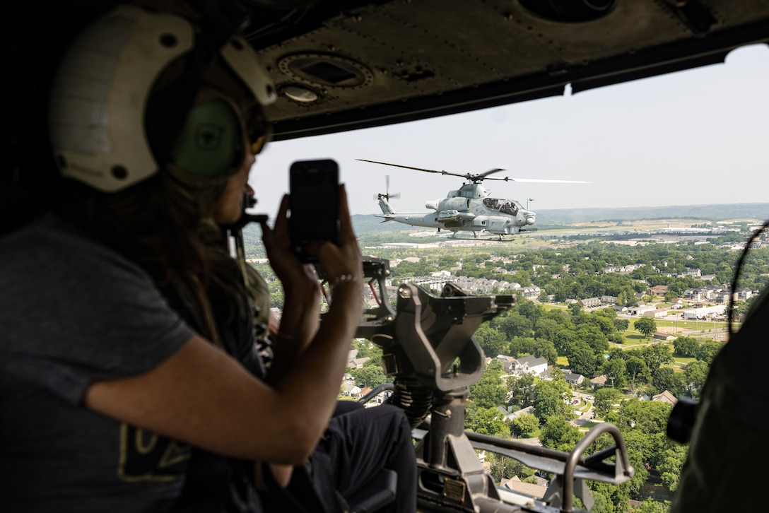 Community leaders participate in an Orientation and Indoctrination Flight as part of Marine Week Nashville at John C. Tune Airport, Nashville, Tennessee, June 3, 2025. The O&I flights allowed an opportunity for community leaders around Nashville to see and experience Marine Corps aviation, and interact with the Marines maintaining and flying these aircrafts. Throughout 2025, Marines across the globe will celebrate the 250th birthday of the Corps, commemorating service, sacrifice, and priding themselves on living 'Semper Fidelis' or 'Always Faithful' to their nation and to each other. (U.S. Marine Corps photo by Lance Cpl. Judith Ann Lazaro)