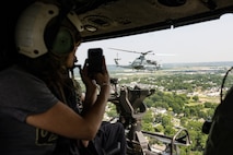 Community leaders participate in an Orientation and Indoctrination Flight as part of Marine Week Nashville at John C. Tune Airport, Nashville, Tennessee, June 3, 2025. The O&I flights allowed an opportunity for community leaders around Nashville to see and experience Marine Corps aviation, and interact with the Marines maintaining and flying these aircrafts. Throughout 2025, Marines across the globe will celebrate the 250th birthday of the Corps, commemorating service, sacrifice, and priding themselves on living 'Semper Fidelis' or 'Always Faithful' to their nation and to each other. (U.S. Marine Corps photo by Lance Cpl. Judith Ann Lazaro)
