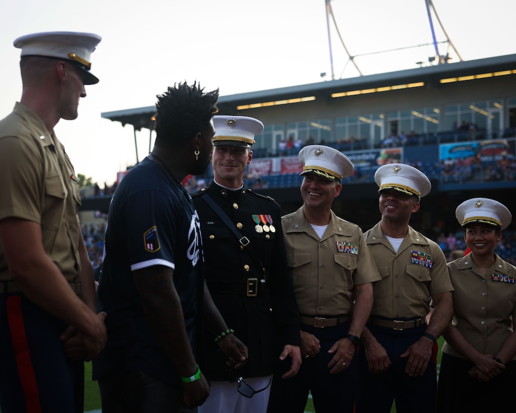 Former Tennessee Titans football player and current podcaster, Delanie Walker, talks to U.S. Marine Corps officers from across the country during a celebrity softball game at First Horizon Park in Nashville, Tenn., June 2, 2025. Founded on November 10, 1775, the United States Marine Corps has served our nation honorably in every clime and place for 250 years. Throughout 2025, Marines across the globe will celebrate the 250th birthday of the Corps, commemorating service, sacrifice, and priding themselves on living "Semper Fidelis" or "Always Faithful" to their nation and to each other. (U.S. Marine Corps photo by Lance Cpl. Brynn L. Bouchard)