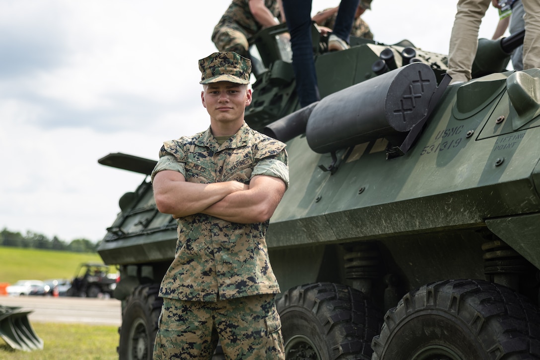 U.S. Marine Corps Lance Cpl. Christopher Miles, a Colorado native, with 1st Battalion, 10th Marine Regiment, 2d Marine Division, poses for a photo at the Cracker Barrel 400 brand activation during Marine Week Nashville 2025 at the Nashville Superspeedway, Nashville, Tennessee, June 1, 2025. Founded on November 10, 1775, the United States Marine Corps has served our nation honorably in every clime and place for 250 years. Throughout 2025, Marines across the globe will celebrate the 250th birthday of the Corps, commemorating service, sacrifice, and priding themselves on living 'Semper Fidelis' or 'Always Faithful' to their nation and to each other. (U.S. Marine Corps photo by Lance Cpl. Judith Ann Lazaro)