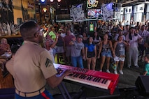 Nashville attendees watch the 2nd Marine Aircraft Wing band, Special-Purpose Marine Air-Ground Task Force 250, perform at the Honky Tonk Central as part of Marine Week Nashville, in Nashville, Tennessee, June 8, 2025. The Honky Tonk Central hosted 2d Marine Aircraft Wing band as a way to show support for the Marine Corps. Throughout 2025, Marines across the globe will celebrate the 250th birthday of the Corps, commemorating service, sacrifice, and priding themselves on living 'Semper Fidelis' or 'Always Faithful' to their nation and to each other. (U.S. Marine Corps photo by Lance Cpl. Judith Ann Lazaro)
