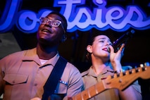 U.S. Marine Corps Sgt. Elizabeth Morino and Cpl. Jobari Noel, Marine musicians with 2nd Marine Aircraft Wing band, Special Purpose Marine Air Ground Task Force-250, perform at Tootsies Orchid Lounge during Marine Week Nashville, in Nashville, Tennessee, June 6, 2025. Tootsies hosted the 2nd MAW band as a way to show support for the Marine Corps. Throughout 2025, Marines across the globe will celebrate the 250th birthday of the Corps, commemorating, service, sacrifice, and priding themselves on living ‘Semper Fidelis’ or ‘Always Faithful’ to their nation and to each other. (U.S. Marine Corps photo by Cpl. Vincent Needham)