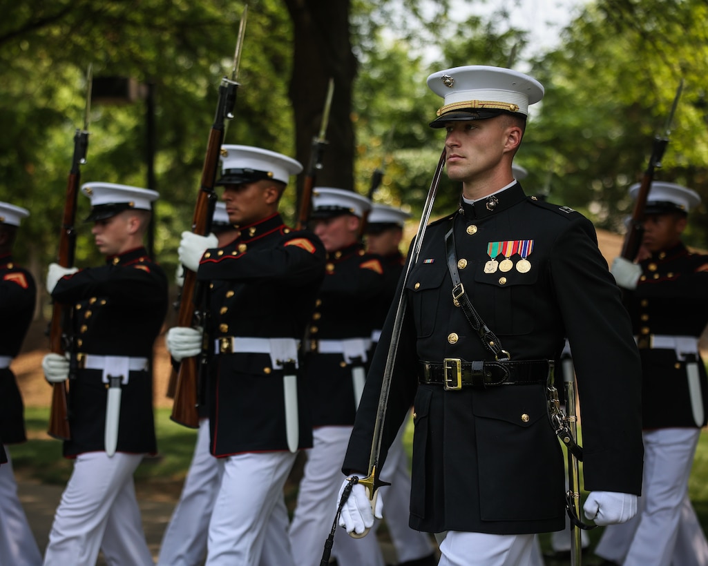 U.S. Marine Corps Capt. Ford Higgins, platoon commander, United States Marine Corps Silent Drill Platoon, Marine Barracks Washington, marches the platoon during a wreath-laying ceremony at the World War II commemoration held at Bicentennial Capitol Mall State Park in Nashville, Tenn., June 4, 2025. The ceremony was part of Marine Week Nashville 2025, honoring the service and sacrifice of World War II veterans. Marines from Marine Barracks Washington participated in the event to preserve tradition, showcase ceremonial excellence, and celebrate 250 years of Marine Corps history. (U.S. Marine Corps photo by Lance Cpl. Brynn L. Bouchard)