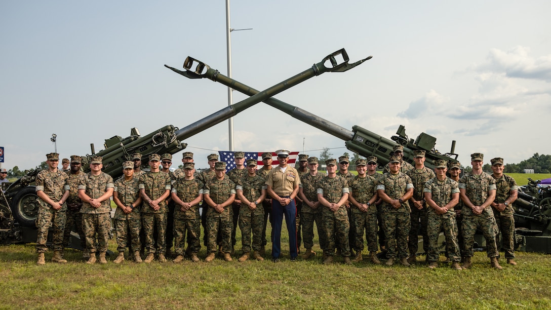 Sergeant Major of the Marine Corps Sgt. Maj. Carlos A. Ruiz, a Sonora, Mexico native, takes a group photo with Marine Corps Installations East during Cracker Barrel 400 brand activation, Marine Week Nashville 2025 at the Nashville Superspeedway, Nashville, Tennessee, June 1, 2025. Founded on November 10, 1775, the United States Marine Corps has served our nation honorably in every clime and place for 250 years. Throughout 2025, Marines across the globe will celebrate the 250th birthday of the Corps, commemorating service, sacrifice, and priding themselves on living 'Semper Fidelis' or 'Always Faithful' to their nation and to each other. (U.S. Marine Corps photo by Lance Cpl. Judith Ann Lazaro)