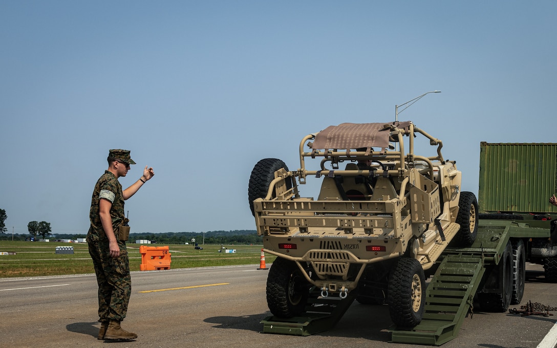 U.S. Marines with Marine Corps Installations East, guide an utility task vehicle off a trailer for the Cracker Barrel 400 brand activation during Marine Week Nashville 2025 at the Nashville Superspeedway, Nashville, Tennessee, June 1, 2025. Founded on November 10, 1775, the United States Marine Corps has served our nation honorably in every clime and place for 250 years. Throughout 2025, Marines across the globe will celebrate the 250th birthday of the Corps, commemorating service, sacrifice, and priding themselves on living 'Semper Fidelis' or 'Always Faithful' to their nation and to each other. (U.S. Marine Corps photo by Lance Cpl. Judith Ann Lazaro)