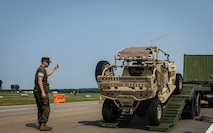 U.S. Marines with Marine Corps Installations East, guide an utility task vehicle off a trailer for the Cracker Barrel 400 brand activation during Marine Week Nashville 2025 at the Nashville Superspeedway, Nashville, Tennessee, June 1, 2025. Founded on November 10, 1775, the United States Marine Corps has served our nation honorably in every clime and place for 250 years. Throughout 2025, Marines across the globe will celebrate the 250th birthday of the Corps, commemorating service, sacrifice, and priding themselves on living 'Semper Fidelis' or 'Always Faithful' to their nation and to each other. (U.S. Marine Corps photo by Lance Cpl. Judith Ann Lazaro)