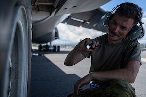 U.S. Air Force Tech. Sgt. Andrew Miller, 436th Maintenance Squadron repair and reclamation noncommissioned officer in charge, conducts post-flight inspections on a C-5M Super Galaxy aircraft assigned to the 439th Airlift Wing in support of the Air Force’s 2025 Department-Level Exercise series at Joint Base Pearl Harbor-Hickam, Hawai’i, July 10, 2025. This mission is part of the first-in-a-generation DLE series, a new way of conducting operations in a contested, dynamic environment to build capabilities making a stronger, more lethal deterrent force. The DLE series encompasses all branches of the Department of Defense, along with Allies and partners, employing more than 400 Joint and coalition aircraft and more than 12,000 members at more than 50 locations across 3,000 miles. (U.S. Air Force photo by Tech. Sgt. Monica Roybal)