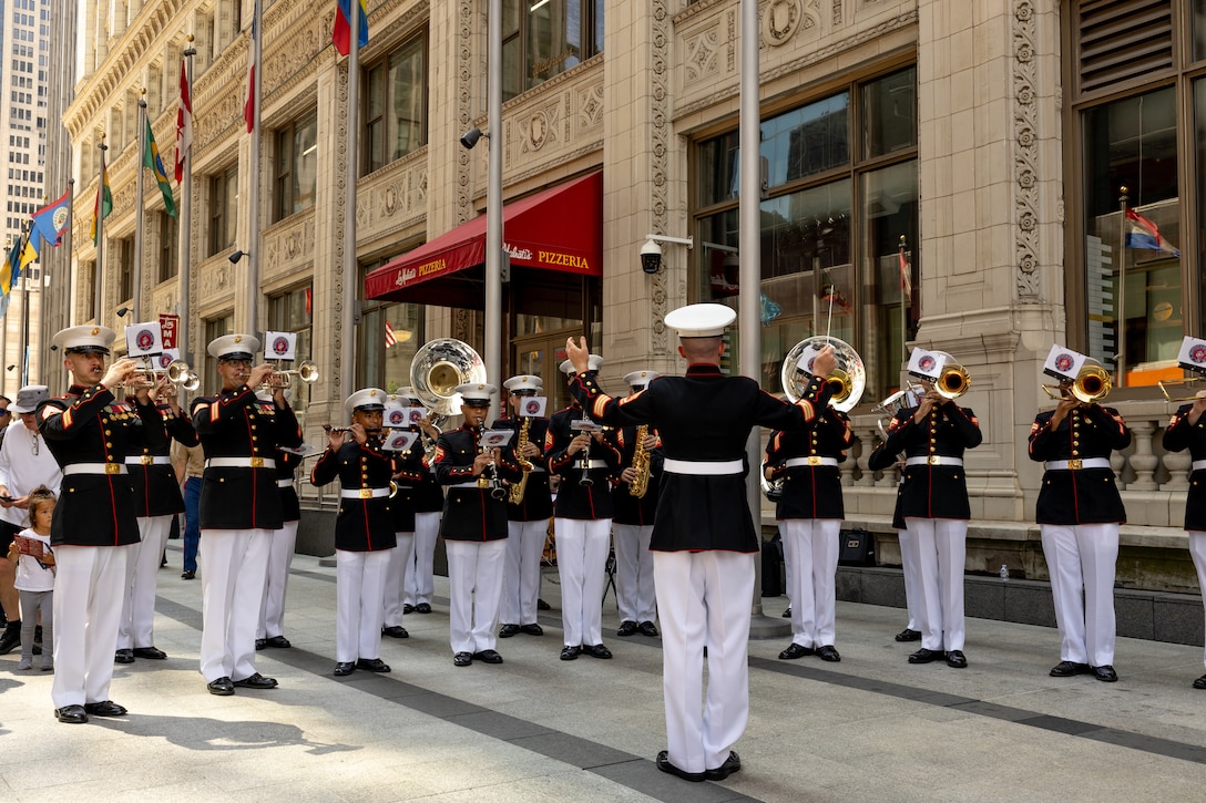 The Quantico Marine Band, assigned to Special Purpose Marine Air-Ground Task Force-250, play a song at the opening ceremony during Marine Week Chicago, July 10, 2025. The Quantico Marine Band played patriotic music to display the Marine Corps’ values in support of the community relations event. Throughout 2025, Marines across the globe will celebrate the 250th birthday of the Corps, commemorating service, sacrifice, and priding themselves on living ‘Semper Fidelis’ or ‘Always Faithful’ to their nation and to each other. (U.S. Marine Corps photo by Lance Cpl. Elijua Guel)