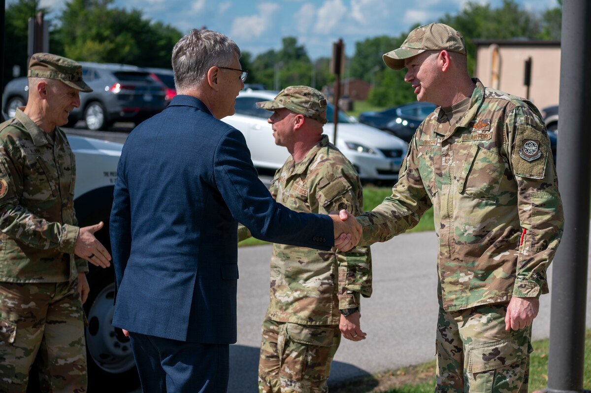 Secretary of the Air Force Troy Meink and Air Force Chief of Staff Gen. David Allvin greet Brig. Gen. Cassius Bentley, 618th Air Operations Center commander and Chief Master Sgt. Nathan Gershon, 618th AOC superintendent at Scott Air Force Base, Illinois, July 9, 2025. The 618th AOC provides rapid global mobility for all combatant commands and is a key player in all Department of Defense operations. (U.S. Air Force photo by Staff Sgt. Ethan Sherwood)