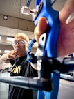 Sgt. 1st Class Hong is working on pulling back on the bow string to get used to the tension.