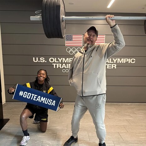 Ret. Maj. Ditlevson working on becoming the next Strongest Man Alive with his cheering section, 1st. Lt. Merritt!