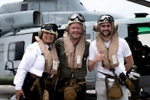 Migdalia Bulnes, left, the deputy chief of Training and Support Group, Chicago Police Department, Daniel O’Shea, center, the executive director of Safety and Security, Navy Pier, and John Gagliardo, the founder of The One Companies, pose for a photo after flying with  Marines during Marine Week Chicago, July 11, 2025. Marines across the globe will celebrate the 250th birthday of the Corps, commemorating service, sacrifice, and priding themselves on living ‘Semper Fidelis’ or ‘Always Faithful’ to their nation and to each other. (U.S. Marine Corps photo by Cpl. Samantha Pollich)