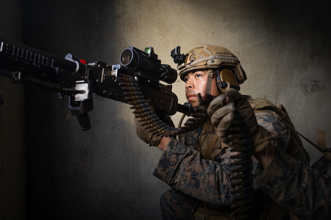 U.S. Marine Corps Lance Cpl. Kenny Hernandez Polanco, a machine gunner with Baker Company, Battalion Landing Team 1st Battalion, 7th Marine Regiment, 31st Marine Expeditionary Unit, returns simulated fire with an M240B machine gun during a simulated air assault at Shoal Water Bay Training Area, Queensland, Australia, July 5th, 2025. Marines participated in a simulated air assault exercise in order to increase their lethality in a realistic combat scenario. The 31st MEU is operating aboard ships of the USS America Amphibious Ready Group in the 7th Fleet area of operations, the U.S. Navy’s largest forward-deployed numbered fleet, and routinely interacts and operates with allies and partners in preserving a free and open Indo-Pacific region. Polanco is a native of California. (U.S. Marine Corps photo by Lance Cpl. Trevor BishopWilliams)