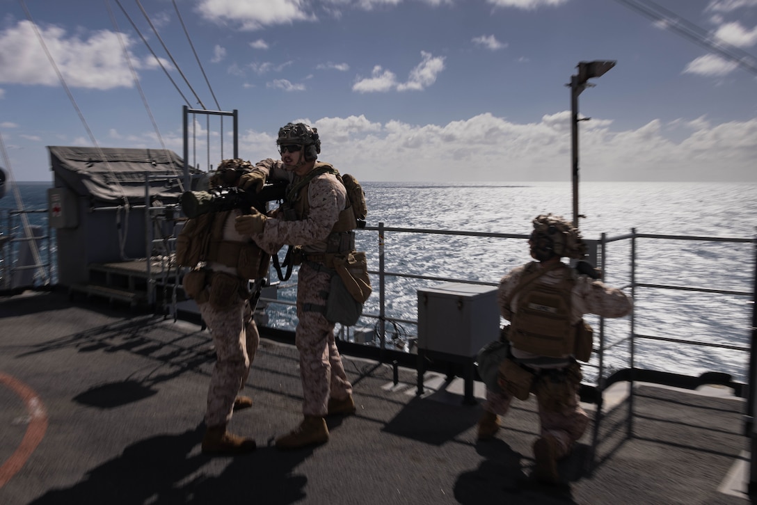 U.S. Marines with Charlie Company, Battalion Landing Team 1st Battalion, 7th Marine Regiment, 31st Marine Expeditionary Unit, engage simulated adversary forces with an M3A1 multipurpose, anti armor, anti personnel weapon system during a visit, board, search and seizure training aboard amphibious dock landing ship USS Rushmore (LSD 47), in the Coral Sea, June 28, 2025. VBSS is part of maritime interception operations that aim to delay, disrupt, or destroy enemy forces or supplies in the maritime domain. The 31st MEU is operating aboard ships of the USS America Amphibious Ready Group in the 7th Fleet area of operations, the U.S. Navy’s largest forward-deployed numbered fleet, and routinely interacts and operates with allies and partners in preserving a free and open Indo-Pacific region. (U.S. Marine Corps photo by Cpl. Angel Diaz Montes De Oca)