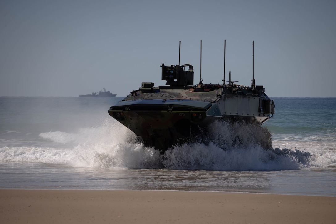 U.S. Marine Corps Amphibious Combat Vehicles assigned to Charlie Company, Battalion Landing Team 1st Battalion, 7th Marine Regiment, 31st Marine Expeditionary Unit, conduct surf passage qualifications during a simulated amphibious assault in Shoalwater Bay Training Area, Queensland, Australia, July 3, 2025. The ACV provides the MEU a ship-to-objective amphibious capability, land mobility, survivability and growth capacity and flexibility to incorporate and adapt future technologies. The 31st MEU is operating aboard ships of the USS America Amphibious Ready Group in the 7th Fleet area of operations, the U.S. Navy’s largest forward-deployed numbered fleet, and routinely interacts and operates with allies and partners in preserving a free and open Indo-Pacific region. (U.S. Marine Corps photo by Sgt. Angel Diaz Montes De Oca)