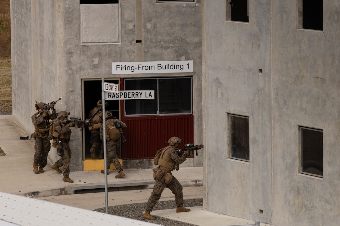 U.S. Marines with Charlie Company, Battalion Landing Team 1st Battalion, 7th Marine Regiment, 31st Marine Expeditionary Unit, engage adversary forces during a simulated amphibious assault in Urban Operations Training Facility, Queensland, Australia, July 5, 2025. The Amphibious Combat Vehicle provides the MEU a ship-to-objective amphibious capability, land mobility, survivability and growth capacity and flexibility to incorporate and adapt future technologies. The 31st MEU is operating aboard ships of the USS America Amphibious Ready Group in the 7th Fleet area of operations, the U.S. Navy’s largest forward-deployed numbered fleet, and routinely interacts and operates with allies and partners in preserving a free and open Indo-Pacific region. (U.S. Marine Corps photo by Sgt. Angel Diaz Montes De Oca)