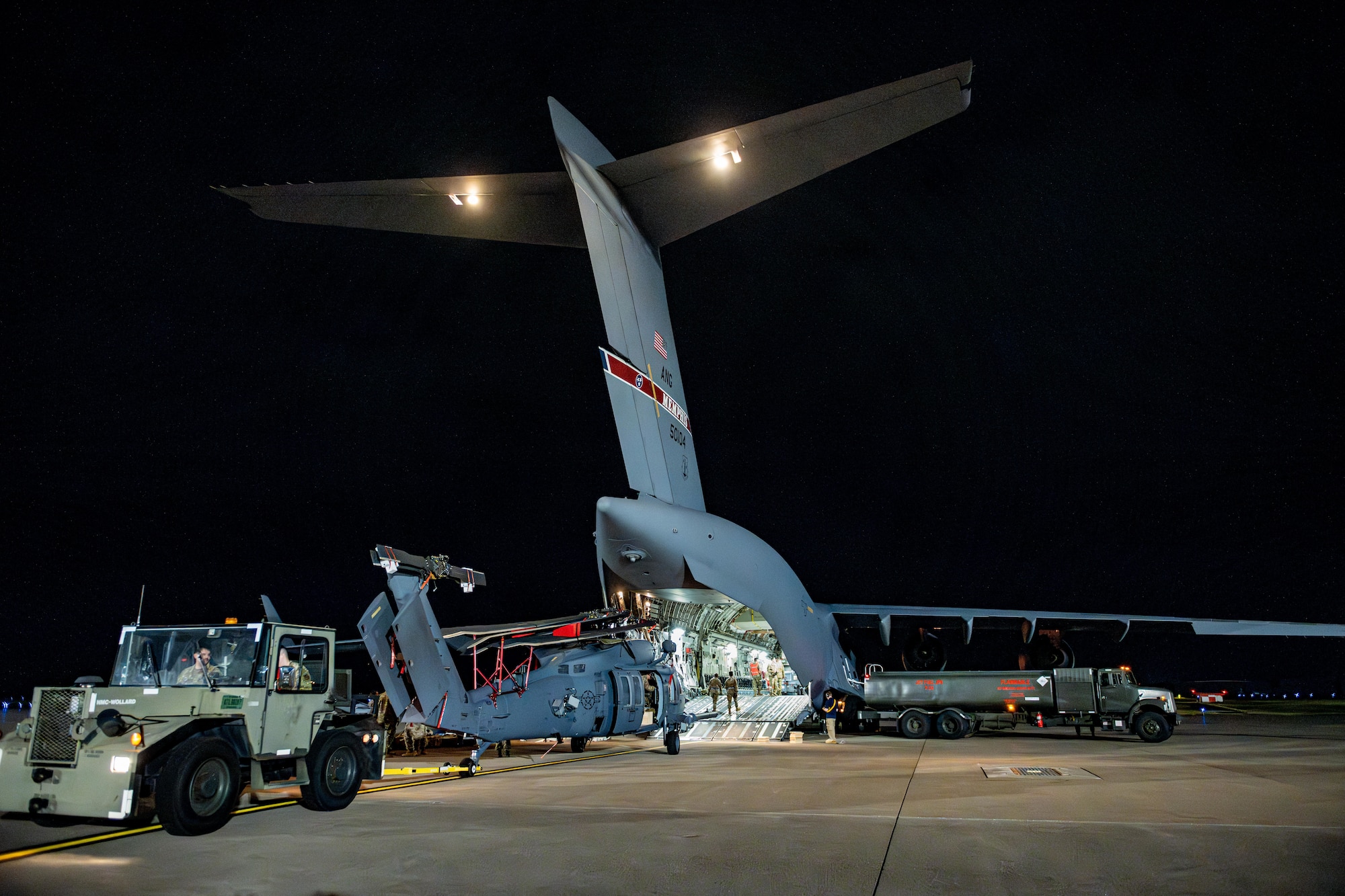 U.S. Air National Guard Airmen assigned to the 106th Logistics Readiness Squadron and the 129th Rescue Wing offload a U.S. Air Force HH-60 Pave Hawk in support of exercise Resolute Force Pacific (REFORPAC) 2025.