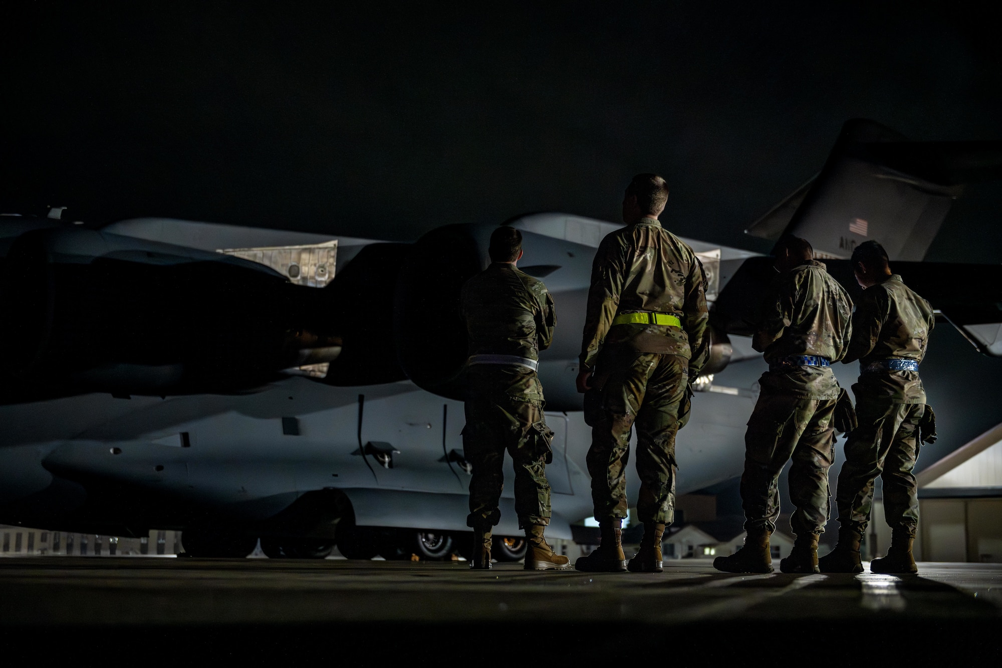 U.S. Air National Guard Airmen assigned to the 106th Logistics Readiness Squadron standby to offload cargo from a C-17 Globemaster III in support of exercise Resolute Force Pacific (REFORPAC) 2025.