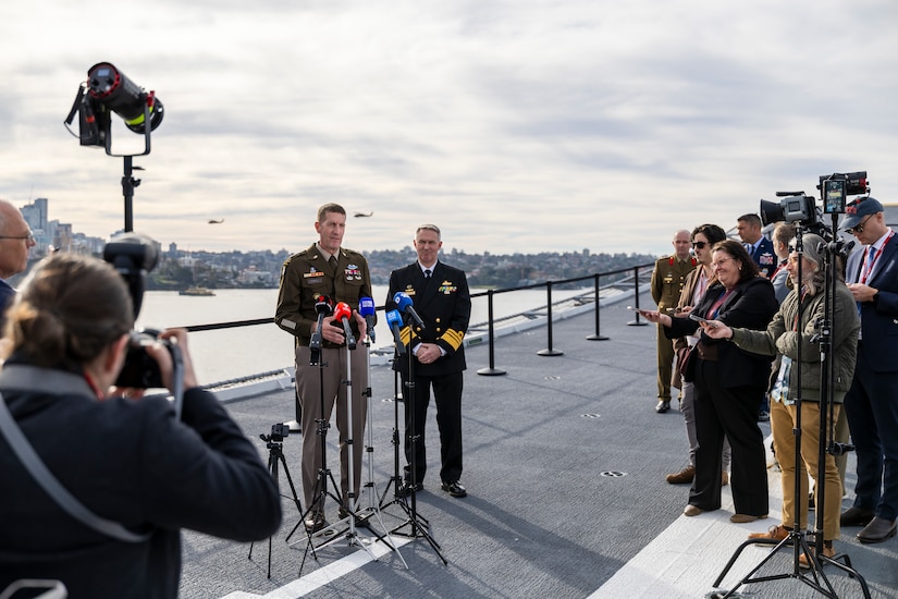 Lieutenant General Joel Vowell, Deputy Commanding General for U.S. Army Pacific (USARPAC) and Australian Defence Force Chief of Joint Operations, Vice Admiral Justin Jones, AO, CSC, RAN address the media at the opening ceremony for Exercise Talisman Sabre 25 onboard HMAS Adelaide in Sydney, New South Wales.