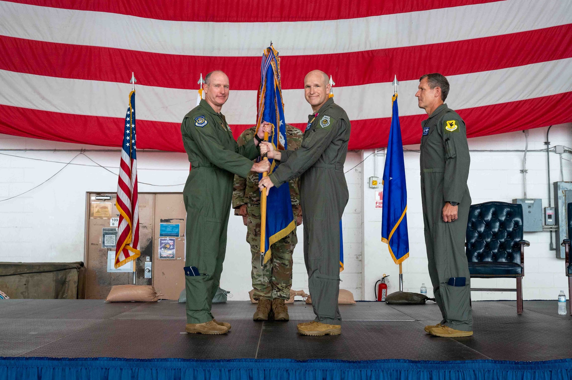 Service member relinquishes guidon.