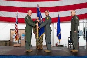 Service member passes guidon to next leadership.