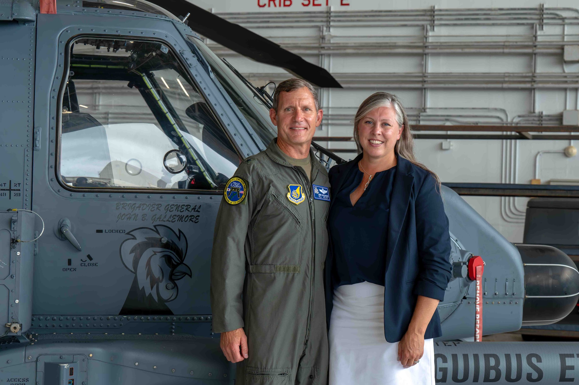 Service member and spouse pose for photo.