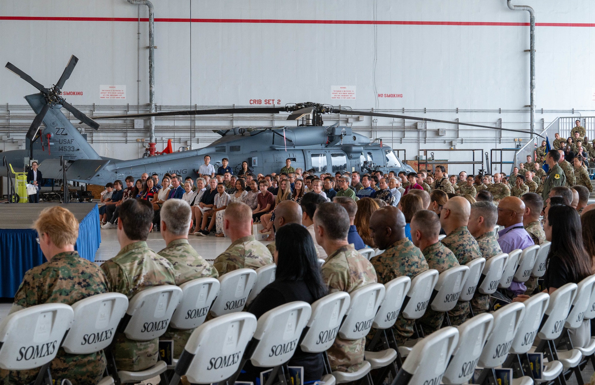 Service members and guests during ceremony.