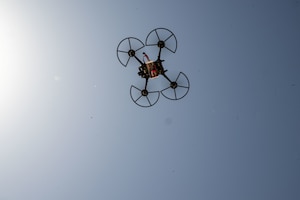 A quadcopter drone flies during drone training within the U.S. Central Command area of responsibility, May 26, 2025. TF-99 is an innovation cell that tests and refines new technologies, ensuring that they can respond to pacing threats with advanced operational solutions. (U.S. Air Force photo by Senior Airman Amanda Jett)