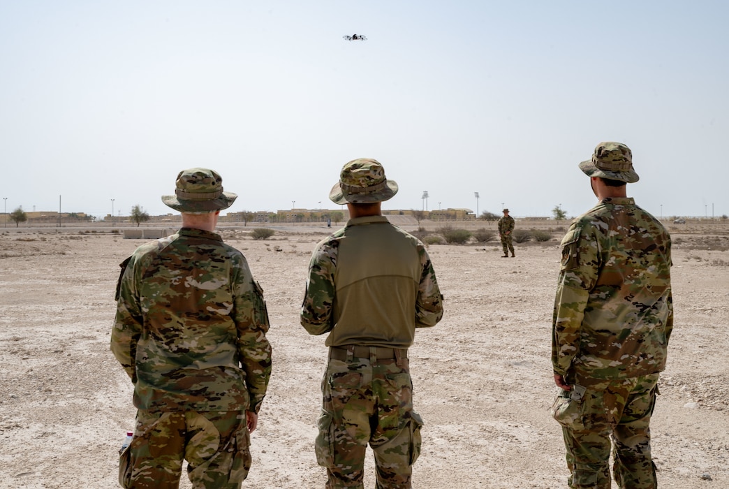 U.S. Airmen assigned to Task Force 99 practice flying a quadcopter drone within the U.S. Central Command area of responsibility, June 6, 2025. TF-99 is a group of Ninth Air Force (Air Force Central) Airmen dedicated to identifying potential threats and developing counter-unmanned aerial systems capabilities to strengthen operational readiness and overcome evolving challenges. (U.S. Air Force photo by Senior Airman Amanda Jett)