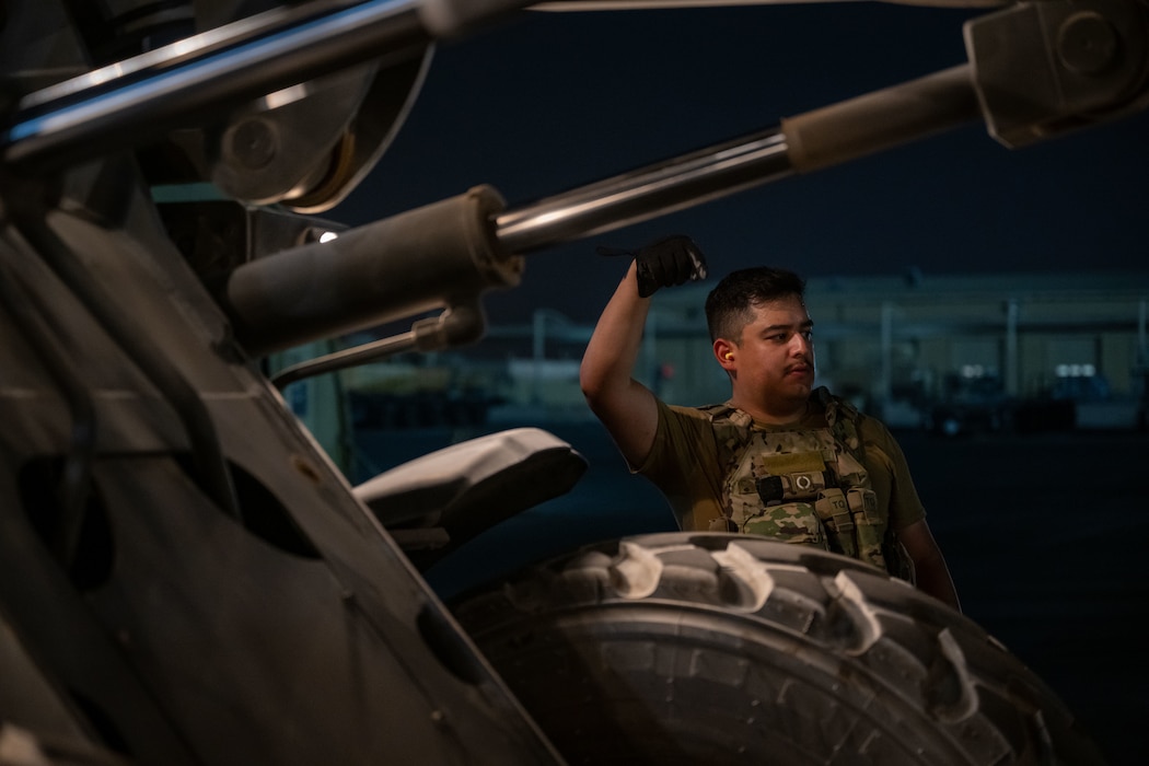 U.S. Air Force Senior Airman Aaron Hernandez, 379th Expeditionary Air Base Group ramp specialist, directs a forklift within the U.S. Central Command area of responsibility, June 14, 2025. The 379th EABG serves as a key component of the 379th Air Expeditionary Wing, supporting missions ranging from humanitarian airlift and mission-essential combat power to aeromedical evacuation and intelligence operations across multiple theaters. (U.S. Air Force photo by Senior Airman Amanda Jett)