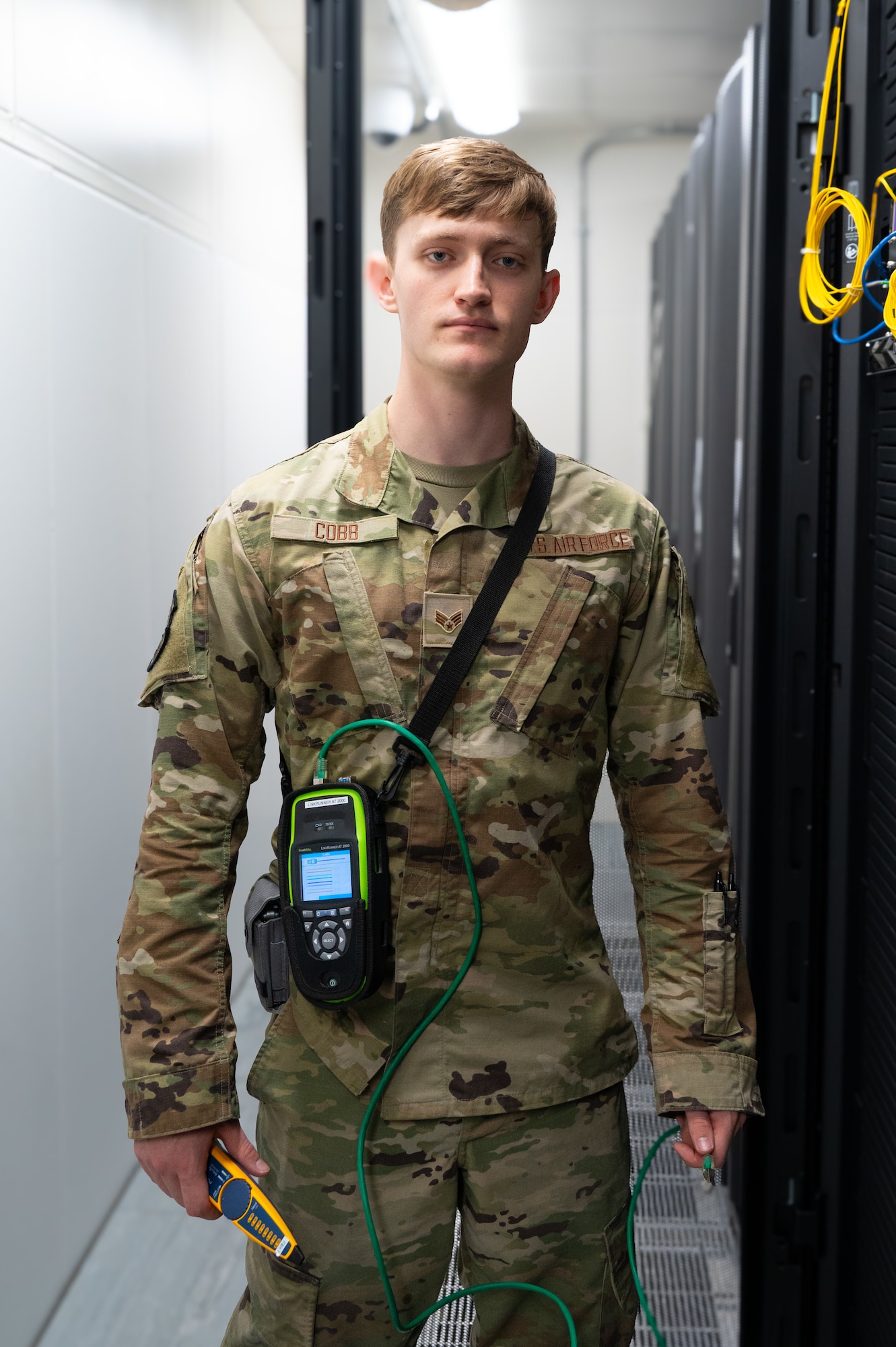 Senior Airman Collin Cobb, cyber network operations technician assigned to the 420th Air Base Squadron, poses for a photo