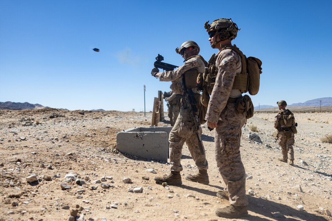 U.S. Marines with 2d Battalion, 8th Marines, 6th Marine Regiment, 2d Marine Division fire an M320 grenade launcher during Service Level Training Exercise 4-25, on Range 104 at Marine Corps Air-Ground Combat Center, Twentynine Palms, California, July 10, 2025. SLTE 4-25 is designed to be a challenging, realistic training environment that produces combat-ready forces capable of operating as an integrated Marine Air Ground Task Force. (U.S. Marine Corps photo by Lance Cpl. Judith Ann Lazaro)