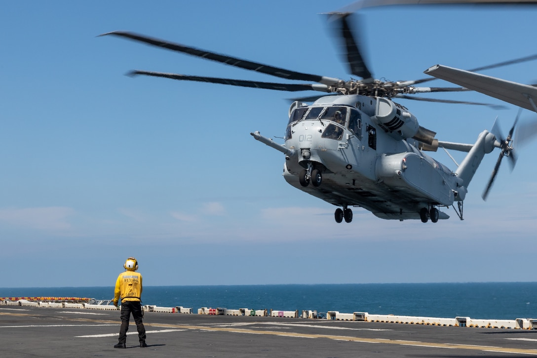 A U.S. Marine Corps CH-53K King Stallion attached to Marine Heavy Squadron (HMH) 461 prepares to land aboard the Wasp-class amphibious assault ship USS Iwo Jima (LHD 7), during Composite Training Unit Exercise while underway in the Atlantic Ocean, July 10, 2025. During COMPTUEX, the IWO ARG and 22nd MEU(SOC), refine tactics, techniques, and procedures to execute warfighting functions that enhance operational readiness and lethality as a unified IWOARG/22MEU(SOC) team. (U.S. Marine Corps photo by Cpl. Sharon Errisuriz)