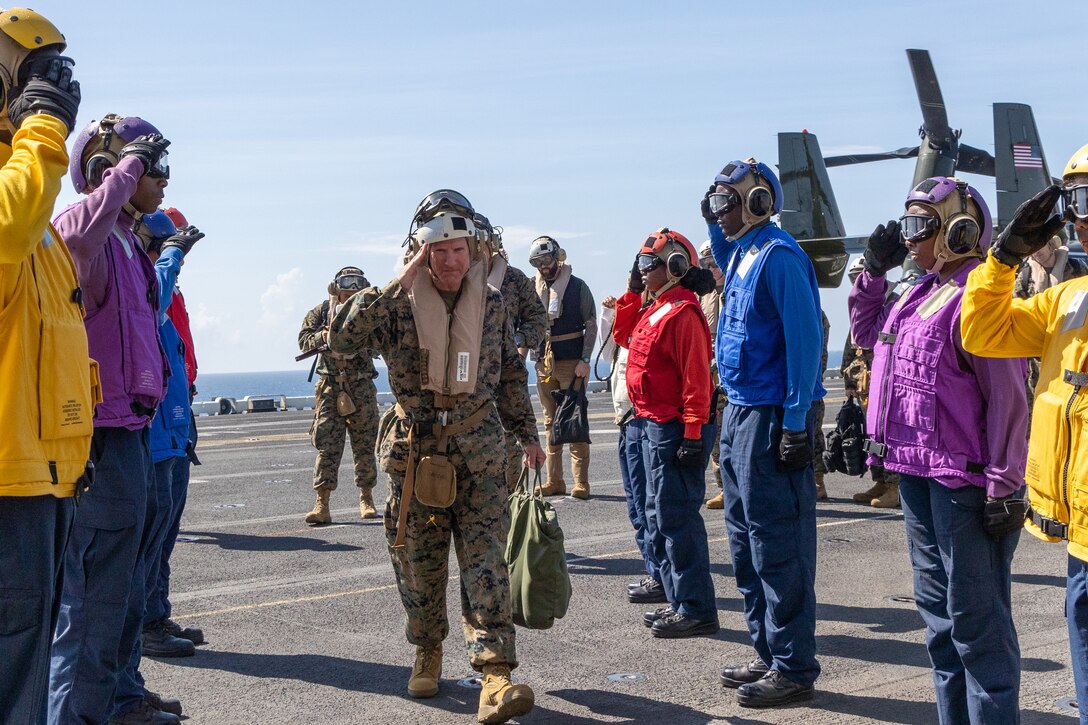 The 39th Commandant of the Marine Corps Gen. Eric M. Smith arrives aboard the Wasp-class amphibious assault ship USS Iwo Jima (LHD 7), for a visit during Composite Training Unit Exercise while underway in the Atlantic Ocean, July 8, 2025. During COMPTUEX, the IWO ARG and 22nd MEU(SOC), refine tactics, techniques, and procedures to execute warfighting functions that enhance operational readiness and lethality as a unified IWOARG/22MEU(SOC) team. (U.S. Marine Corps photo by Cpl. Sharon Errisuriz)