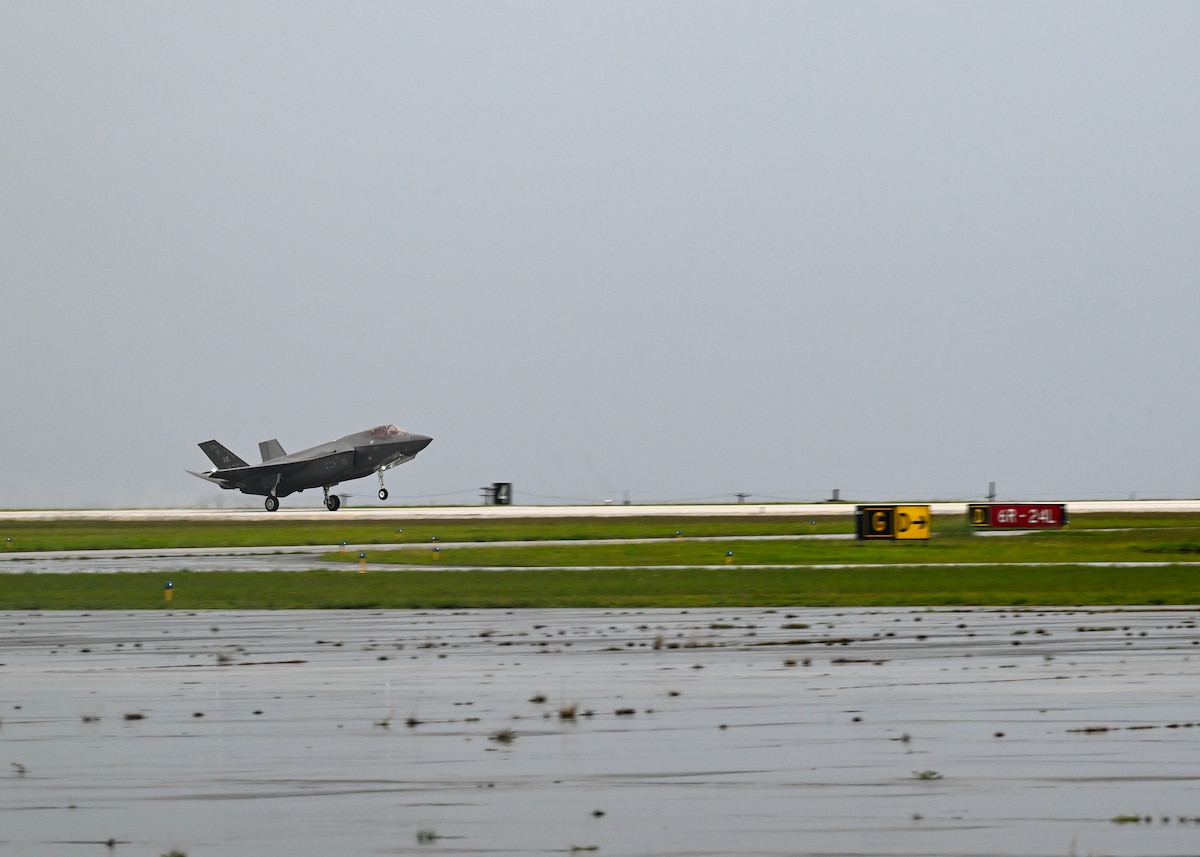 F-35 taking off from runway.