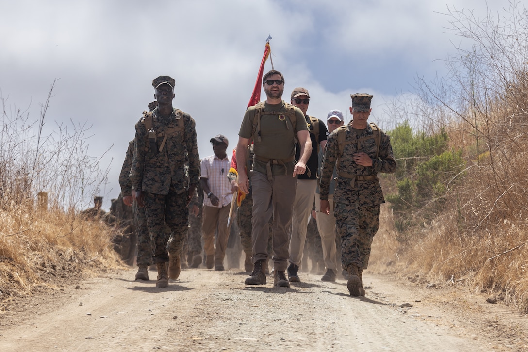U.S. Marines with Headquarters and Support Battalion, Marine Corps Base Camp Pendleton, conduct a hike with the Vice President of the United States, the Honorable JD Vance, at MCB Camp Pendleton, California, July 11, 2025. Vance, a former Marine, led the hike to reinforce the values of camaraderie and unit cohesion. A fundamental element in Marine training, hiking builds both physical endurance and mental resilience in preparation for future battles. (U.S. Marine Corps photo by Sgt. Edgar Rafael)
