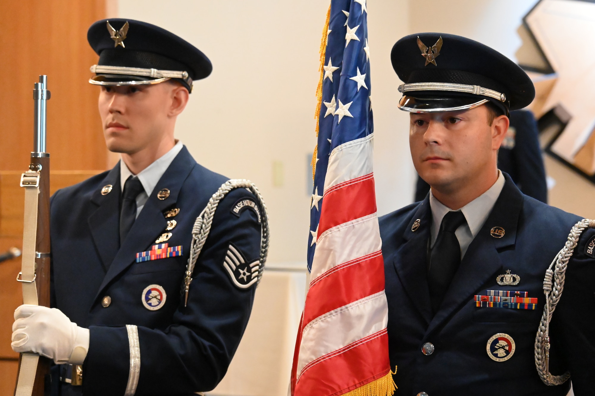Members of the honor guard present arms at the change of command ceremony.