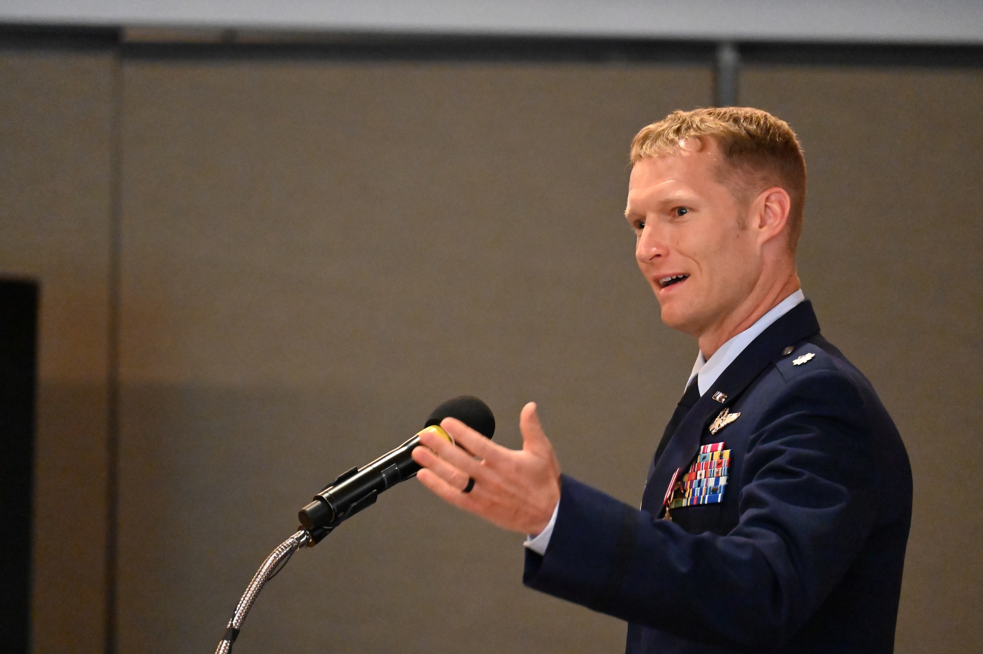 Outgoing commander addresses audience from the podium