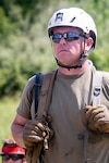 Air Force Staff Sgt. Bram Sanders, a medic with the 181st Medical Group Search and Extraction element assigned to the 19th Chemical, Biological, Radiological, Nuclear, and high-yield Explosives Enhanced Response Force Package, Indiana National Guard participates in training at a simulated disaster site during a pre-external evaluation sustainment year collective training event at Camp Atterbury Joint Maneuver Training Center, Ind., Aug. 10, 2022.