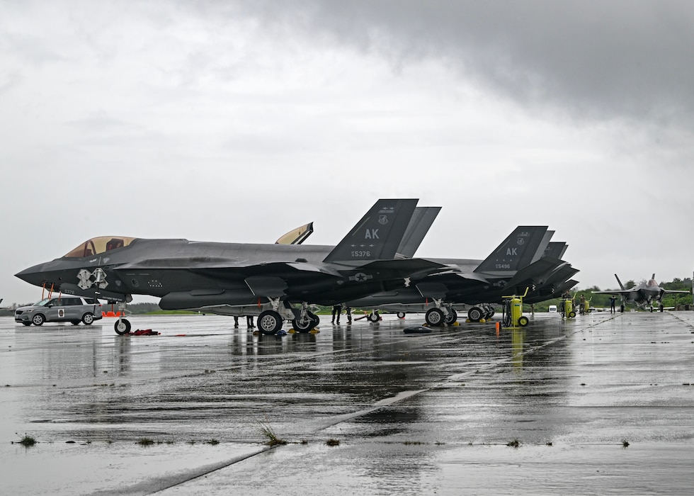 F-35s parked on flightline.