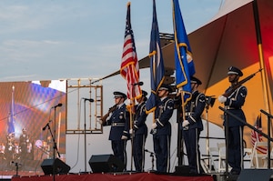 Airmen present the colors on stage. (U.S. Air Force photo by Airman 1st Class Donnell Ramsey)