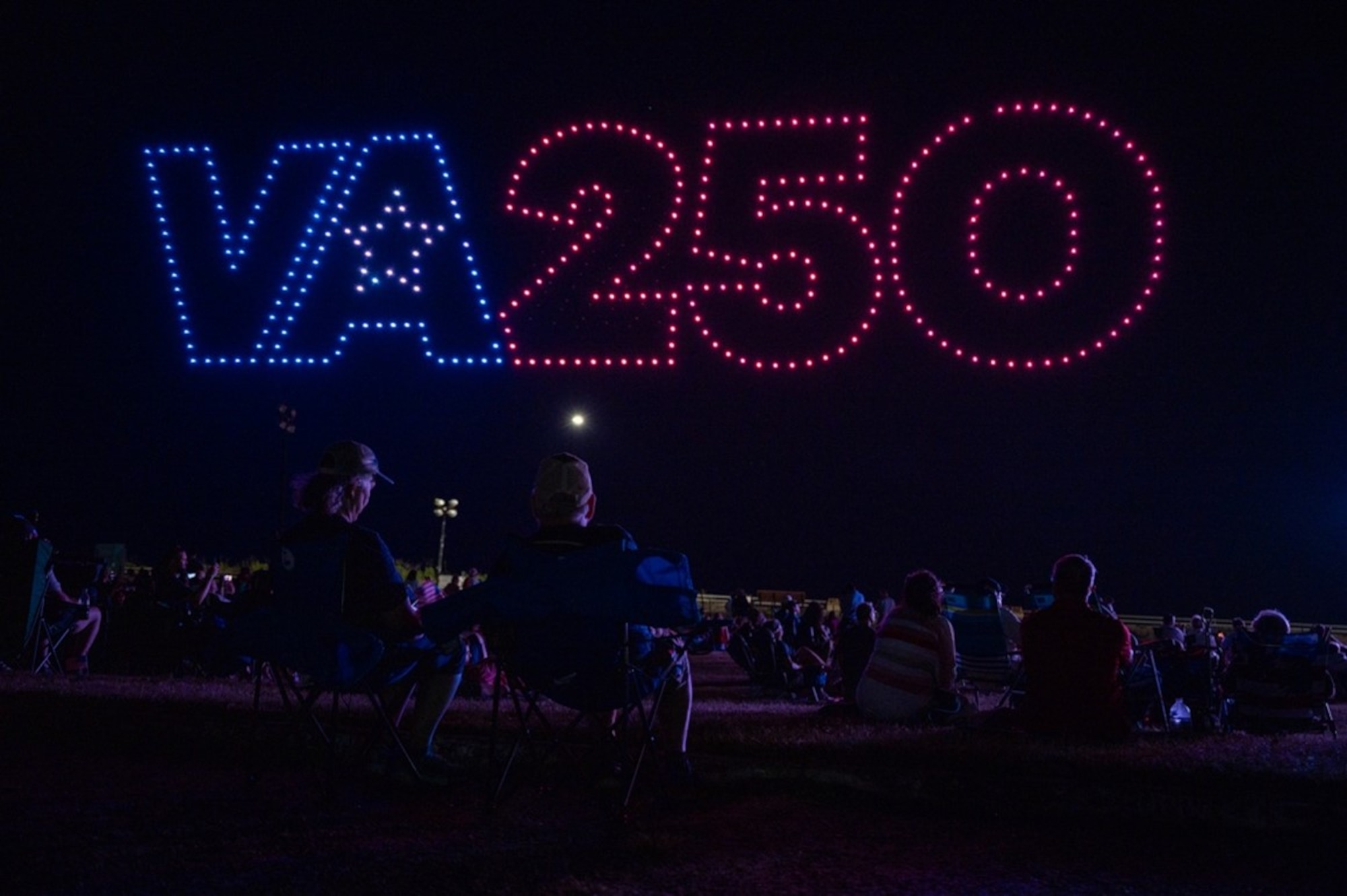 Attendees watch drones form VA 250 display. (U.S. Air Force photo by Airman 1st Class Donnell Ramsey)