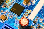 A circuit board contains multiple examples of important microelectronics innovation. The Defense Department's microelectronics commons aims to close gaps in America's ability to bring new microelectronics technology to market.