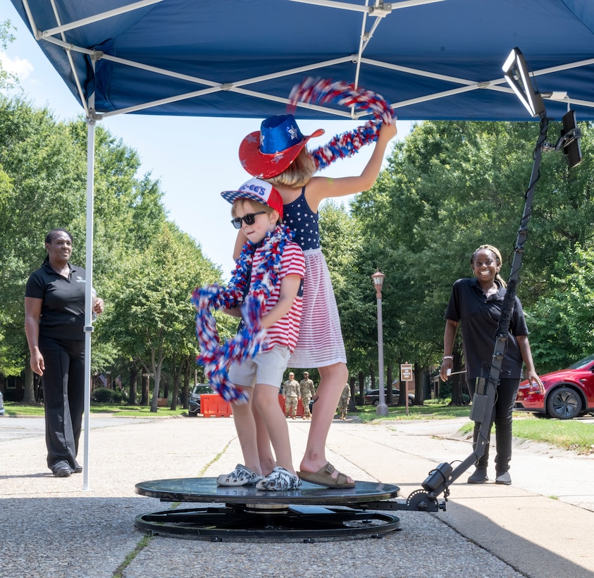 Family dance on rotating platform. (U.S. Air Force photo by Airman 1st Class Thalia Bonte)