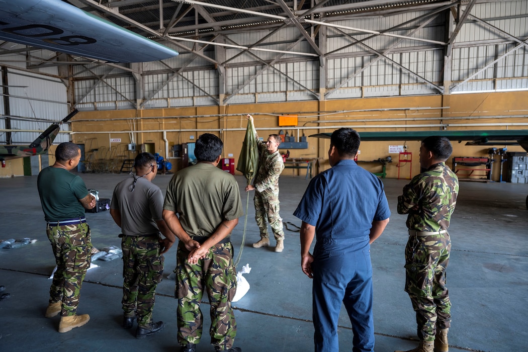 U.S. Airman talks with Belize military service members