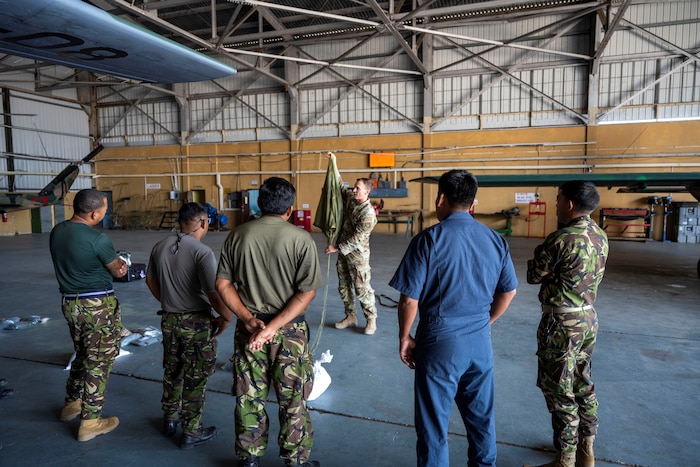 U.S. Airman talks with Belize military service members