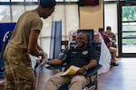 U.S. Air Force Airman Devin Jonson, 59th Medical Diagnostics and Therapeutics Squadron medical laboratory technician, prepares to draw blood from Commie Whigham, Air Education Training Command contract specialist, during the Armed Services Blood Bank Center-San Antonio blood drive at Joint Base San Antonio-Randolph, Texas, July 9, 2025. The event aimed to boost blood donations during summer months when blood supply typically decreases.