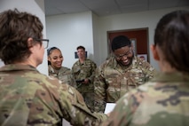 A group of Airmen out process.