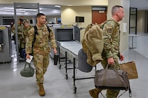 A group of Airmen out process.